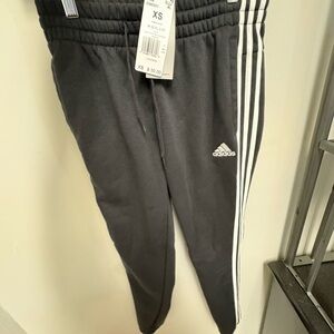 Adidas women’s  Black Joggers with White Stripes